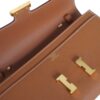 HERMÈS CONSTANCE TO GO close up of signature hardware detail