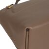 HERMÈS 24/24 MINI mannequin side profile shot with strap drape