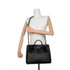 Bottega Veneta Andiamo Medium Black Woven Leather Bag – Front View Carried by Hand on Mannequin | KC Luxury Bags